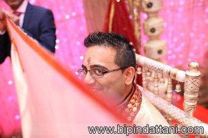 Groom waiting under the wedding stage waiting for the bride's entrance