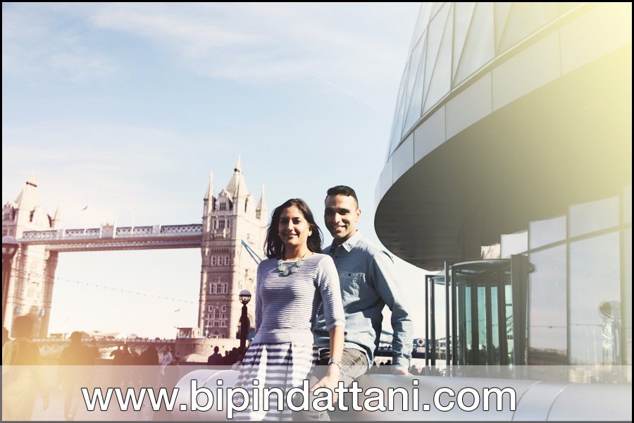 pre wedding couple's photo by top london wedding photographers near city hall on the Thames