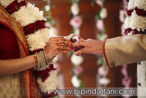 Khiloni putting ring on Amish at hare krishna temple wedding in watford