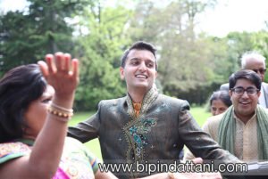 joyous guests doing band baaja wedding garba at groom's entrance