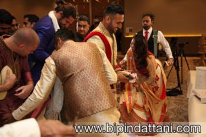 stealing the groom's shoes at an hindu Indian wedding
