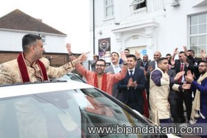 grooms entrance with at Saffron D'or Southall UB1 2QB wedding