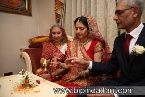 Khiloni performing the ganesh puja at the start on the indian wedding ceremony