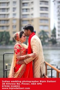 happy couple portrait shoot near river Thames in London by indian wedding photographer Bipin Dattani
