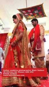 wedding photographer at work in London during indian wedding